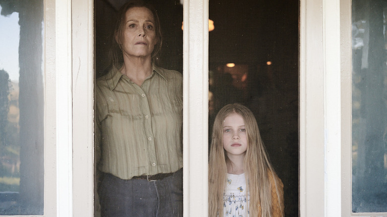 Alice and June Hart looking out of a window on The Lost Flowers of Alice Hart