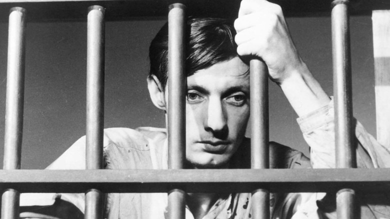 Fontain holds onto prison bars in 'A Man Escaped' (1956)