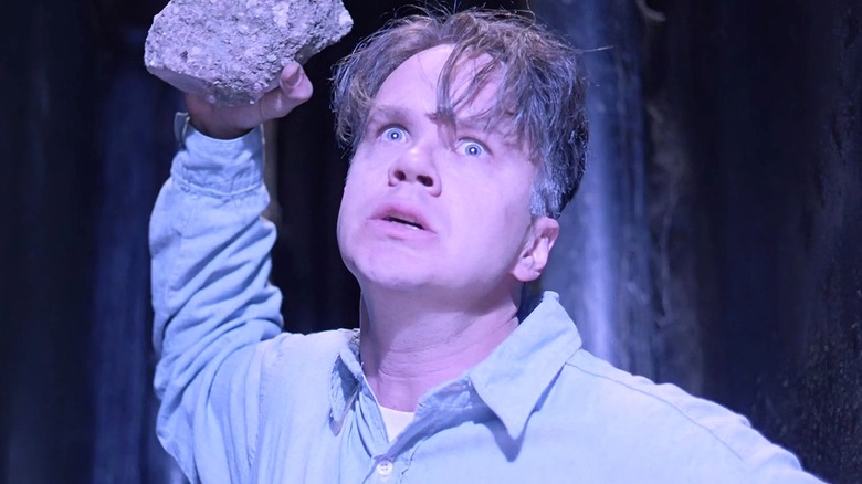 Andy Dufresne breaking out of prison with a rock in 'The Shawshank Redemption' (1994)