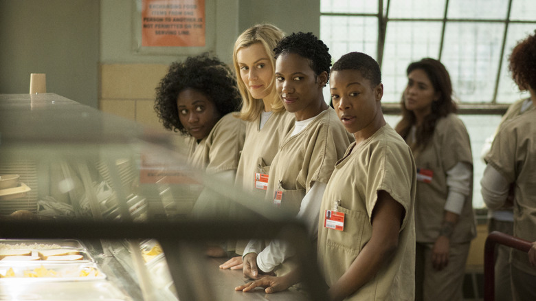 Taystee, Piper, Janae, and Poussey in the prison cafeteria in "Orange Is the New Black" (2013)