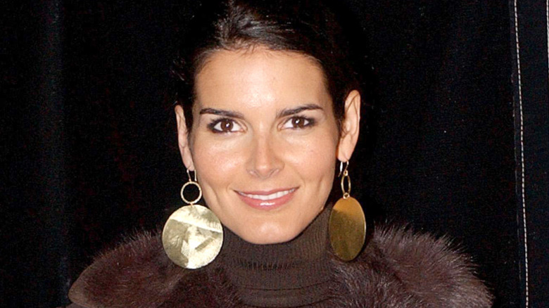 Angie Harmon wearing gold earrings