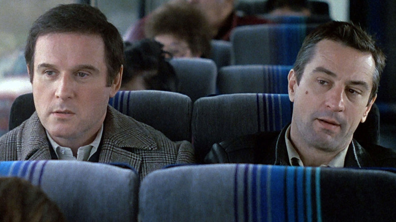 Jack Walsh and Jonathan Mardukas sit on a bus in Midnight Run