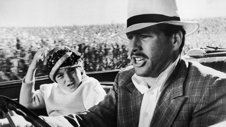 Moses and Addie drive quickly in Paper Moon