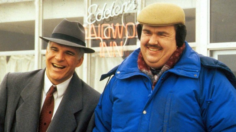 Neal Page and Del Griffith laugh together in Planes, Trains and Automobiles