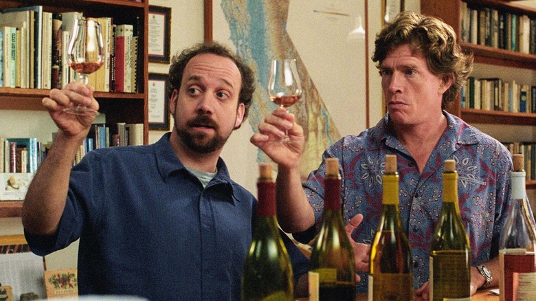 Miles and Jack examine a glass of wine in Sideways