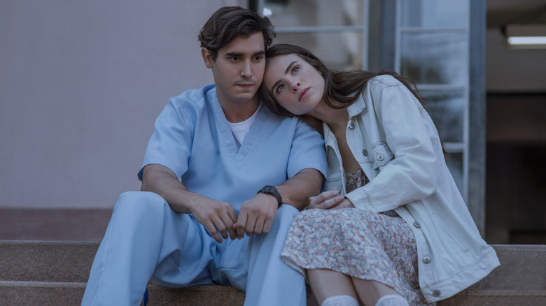 Gabriel and Nina sitting on steps in "Beyond the Universe."