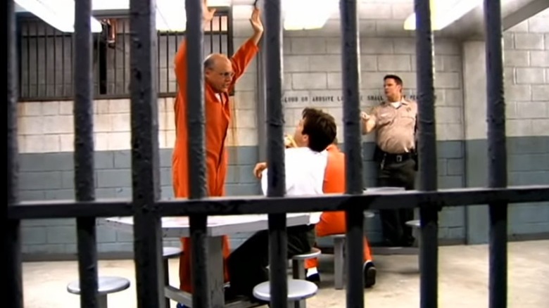 George Sr. with arms in air