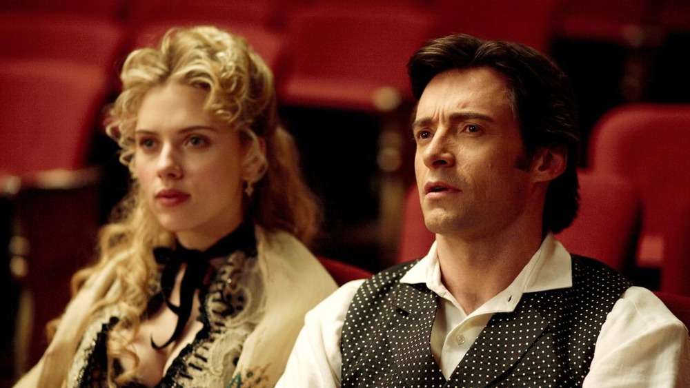 Johansson sits with Hugh Jackman 
