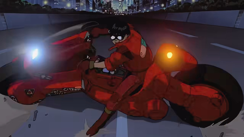Kaneda slides down a Neo-Tokyo street on his motorcycle in "Akira" (1988)