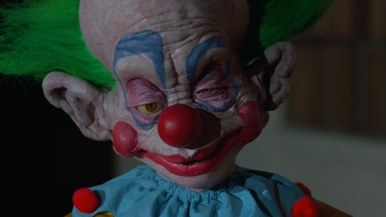 An ugly alien clown sizes up humans in "Killer Klowns from Outer Space" (1988)