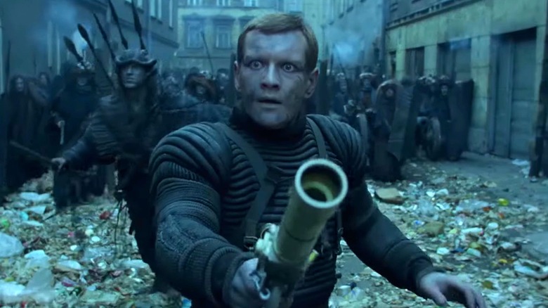 Astronaut Marek leads the charge in the city of alien Sherns in "On the Silver Globe" (1988)