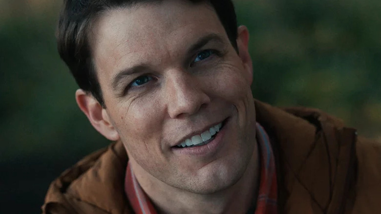 Jake Lacy smiles