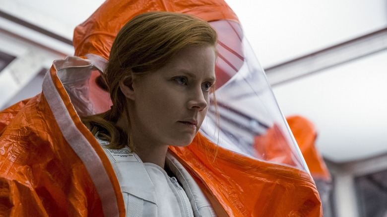 Louise Banks dons an orange hazmat suit in 'Arrival' (2016)