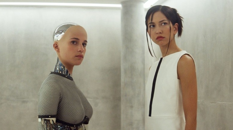 Ava the humanoid robot talks to Kyoko the assistant in 'Ex Machina' (2014)