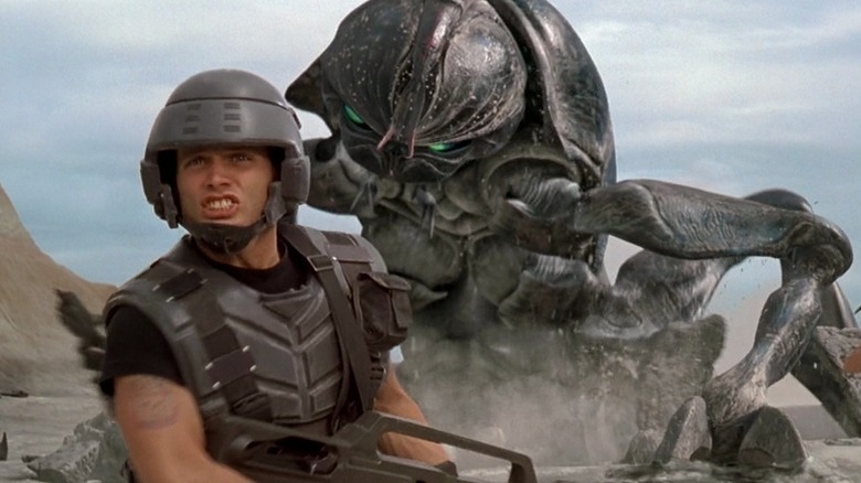 Soldier standing in front of Arachnid