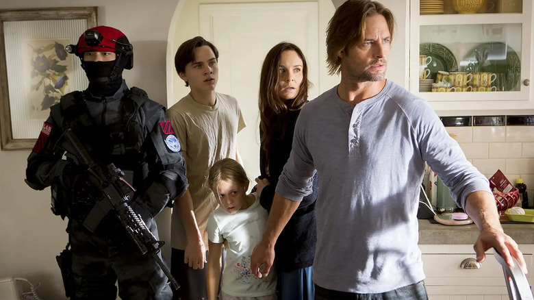 Will standing in front of Katie, Bram, Grace, and a soldier in "Colony."