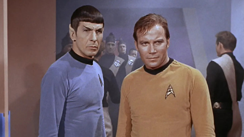 Spock with a straight face and Kirk smiling in "Star Trek: The Original Series."