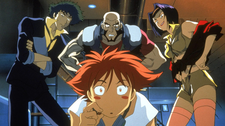 Ed kneels down with her eyes wide as Spike Spiegel, Jet Black, and Faye Valentine stand behind her glower with their arms crossed in "Cowboy Bebop"