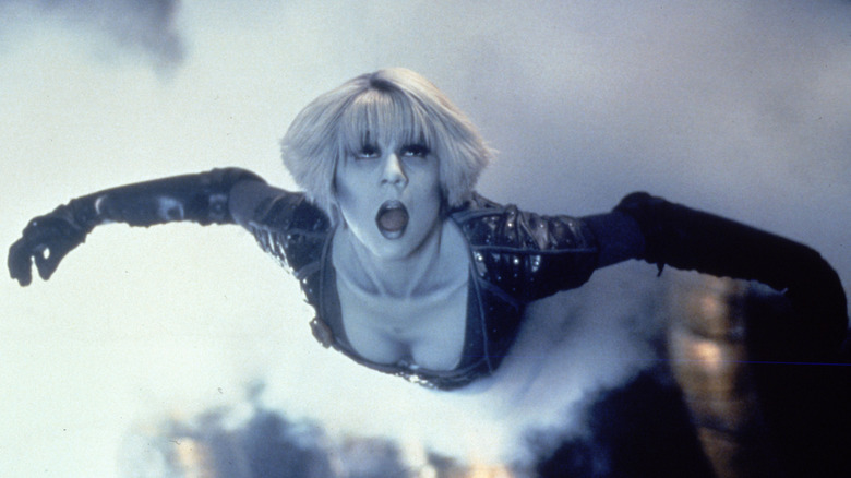 Chiana flying through a cloud of smoke in Farscape (1999)
