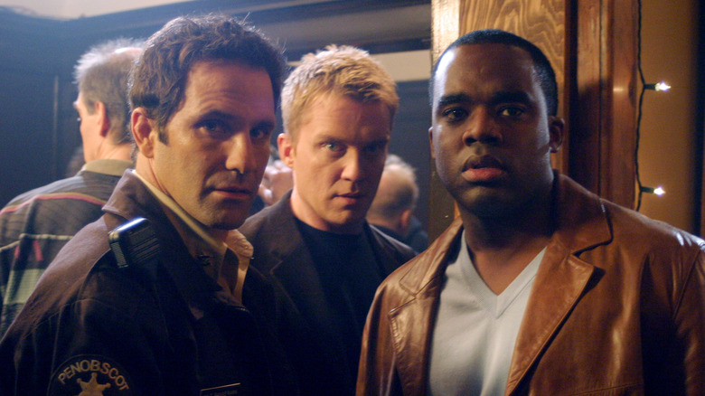 Walt, Johnny, and Bruce looking in the same direction in The Dead Zone (2002)