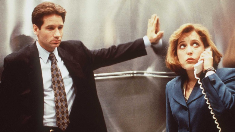 Mulder and Scully in an elevator in The X-Files (1993)