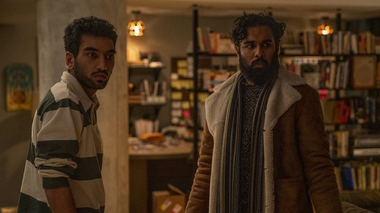 Jeevan and Frank Chaudhary both turning to look with worry in "Station Eleven"