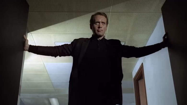 Number Six opens a mysterious door in "The Prisoner"