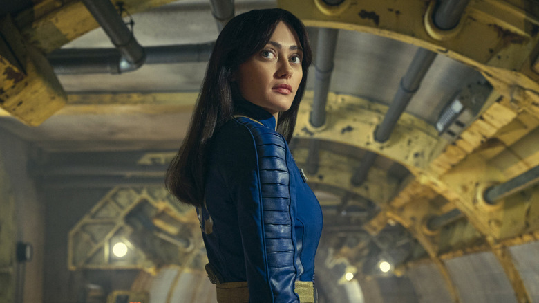Lucy stands in a Vault in "Fallout" (2024-present)