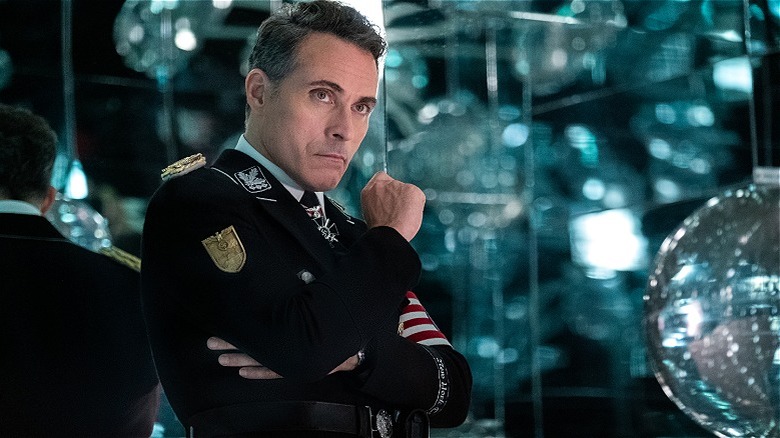 John Smith looking thoughtful by disco balls in The Man in the High Castle (2015)