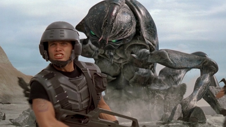 Arachnid attacking a UCF soldier in "Starship Troopers" (1997)