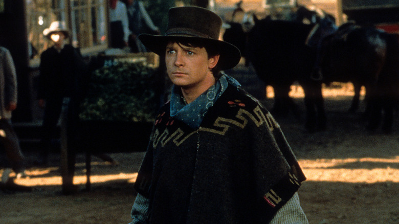 Marty in a cowboy hat and poncho in Back to the Future Part III (1990)