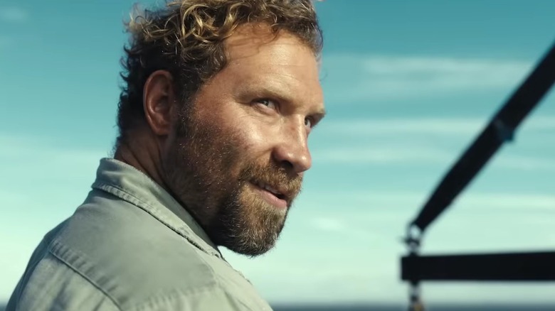 Bruce looking over his shoulder and smirking creepily, in Dangerous Animals