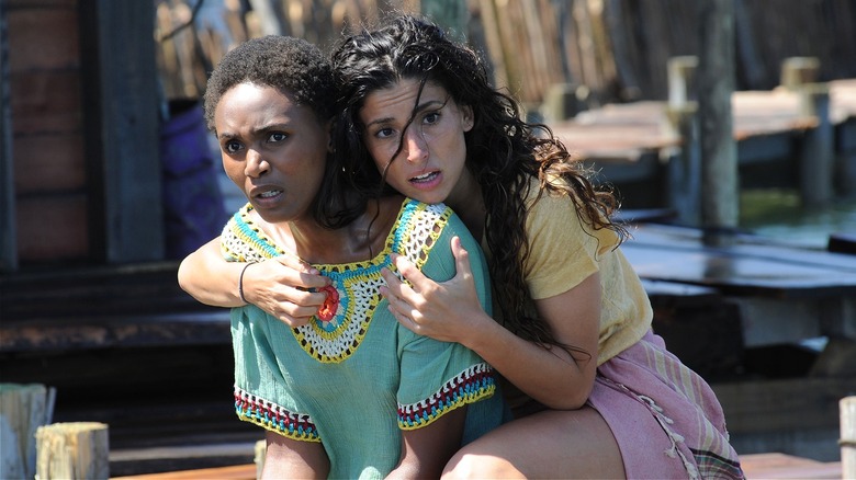 Emma clinging onto Nandi scared in Deep Blue Sea 3