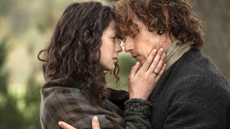 Claire and Jamie embrace