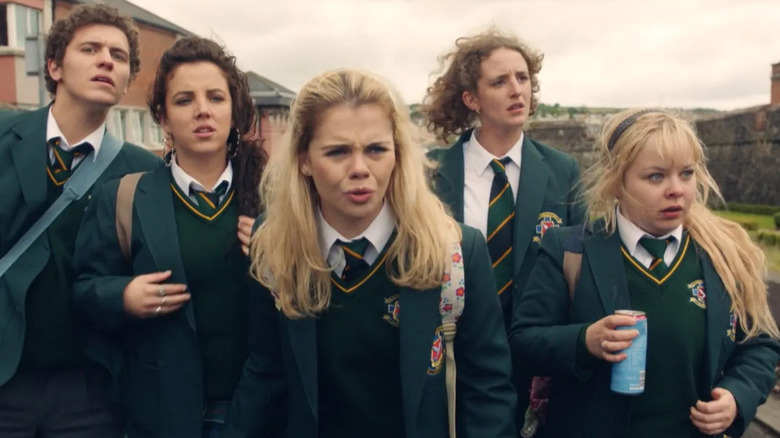 James, Michelle, Erin, Orla, and Claire walking to school, dressed in their uniforms in Derry Girls
