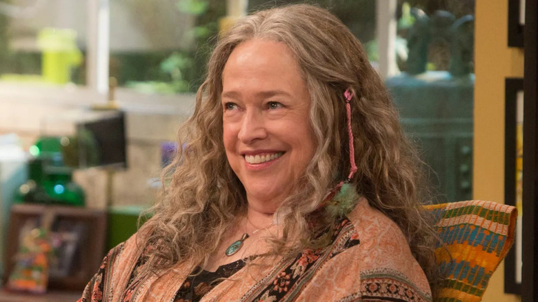 Ruth Whitefeather smiling at her desk in Disjointed