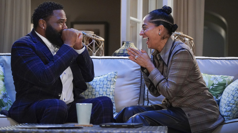 Dre and Rainbox laughing excitedly together in "Black-ish"