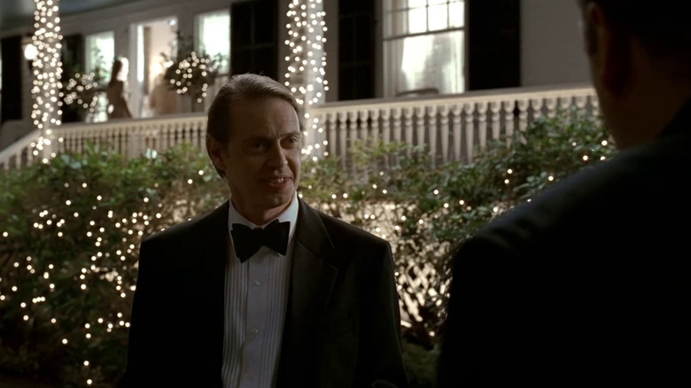 Steve Buscemi stands in garden