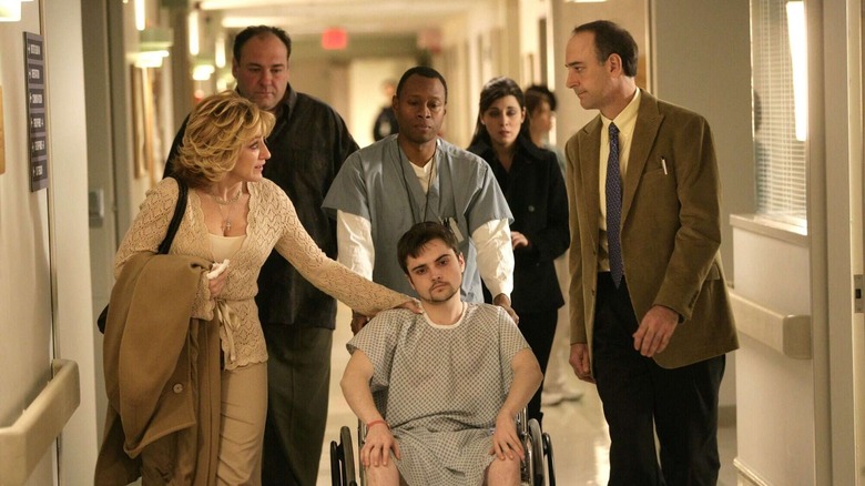 AJ and family walk down hospital hallway