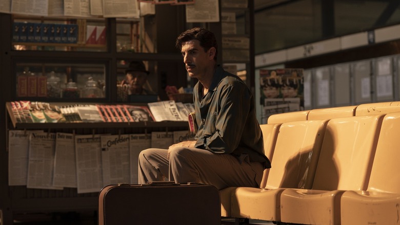 Eli Cohen sitting on a chair in The Spy