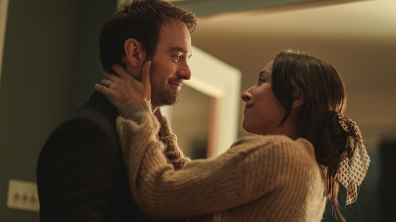 Maddy Lawrence holding Adam's face in Treason