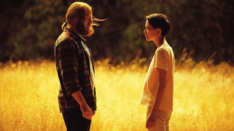 Lily and Forest looking at each other in a field in "Devs"