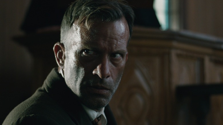 Wilf in 1922, turning around, looking manically paranoid