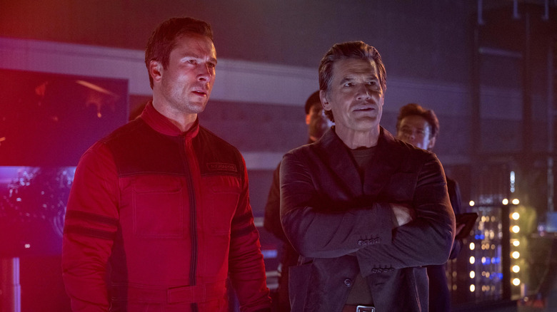 Ben Richards and Dan Killian standing together in "The Running Man" (2025)