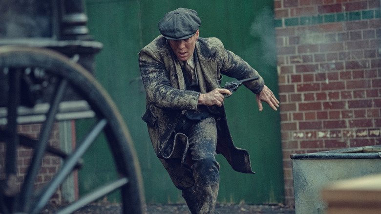 Tommy running with a gun in "Peaky Blinders: The Immortal Man" (2026)