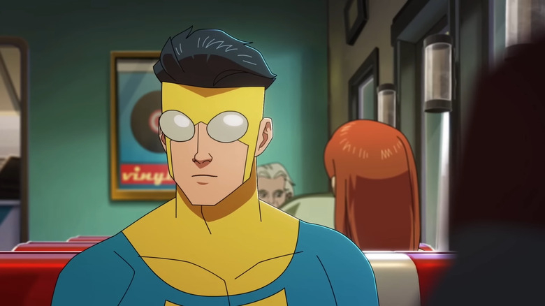 Invincible sitting in a diner