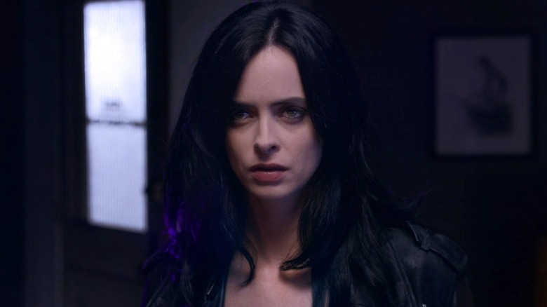 Jessica Jones staring in a dark room