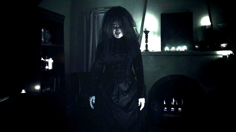 The Bride in Black smiling in "Insidious"