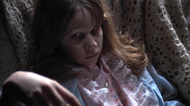 A possessed Regan MacNeil looking up in "The Exorcist"