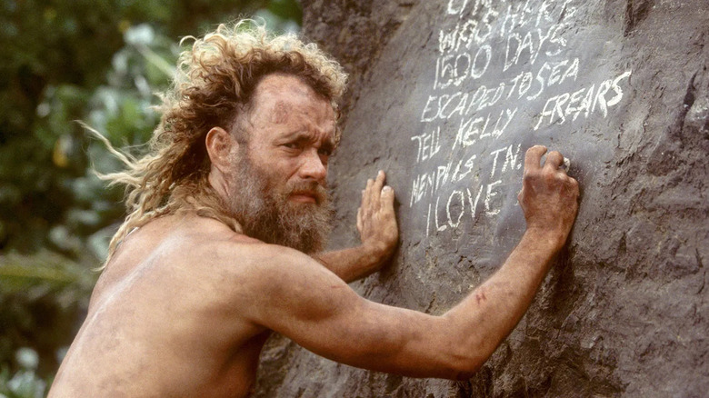 Chuck Noland writing on a rock in chalk